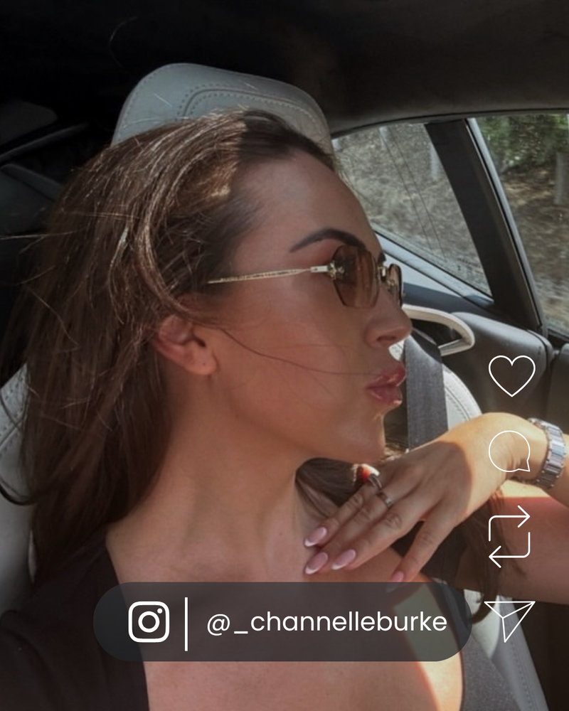 Woman wearing VOYA premium sunglasses while driving