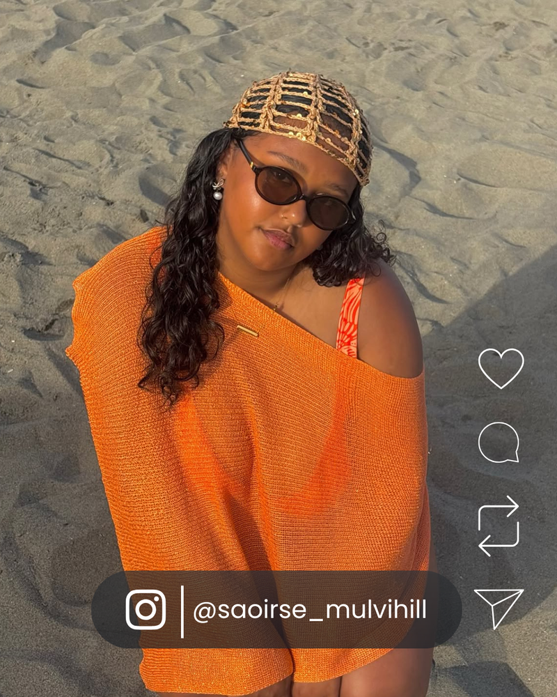 Woman wearing stylish VOYA shades while travelling.